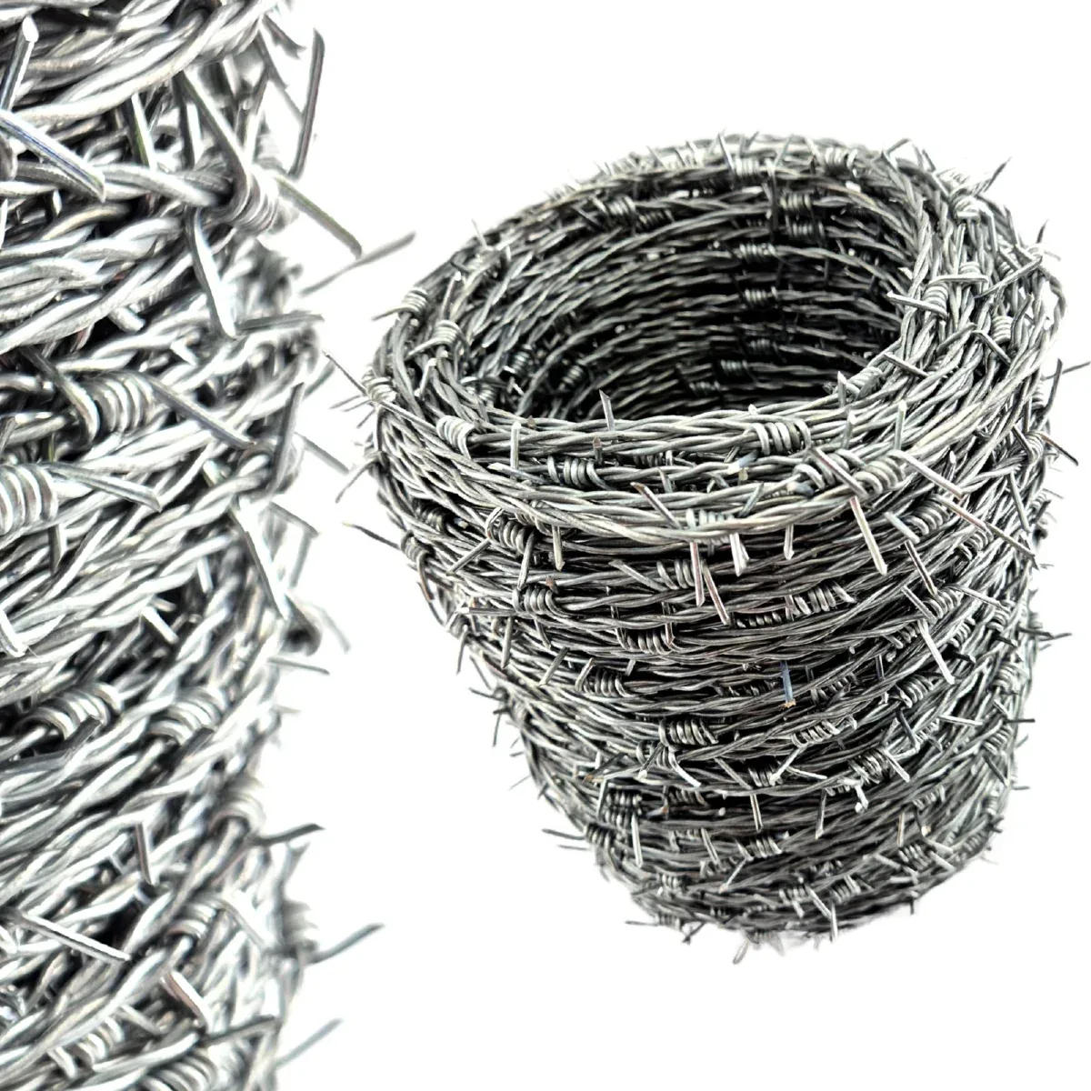 Galvanised barbed wire rolls ready for boundary fencing